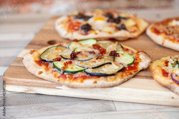 Fototapeta Close up of a pizza with vegetables