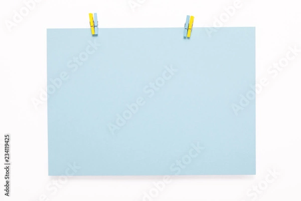 Fototapeta paper card on clothes peg on white background