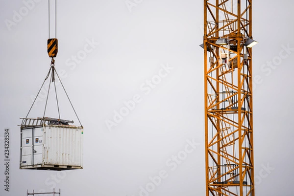 Obraz floating house elements on a crane