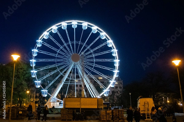 Fototapeta Biggest Ferris wheel in Brno, Czech Republic in Moravske square during set up for Christmas event captured at night time