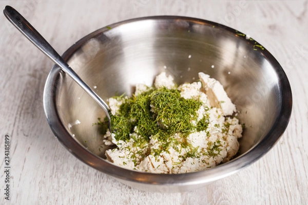 Obraz Cheese with cut dill on top