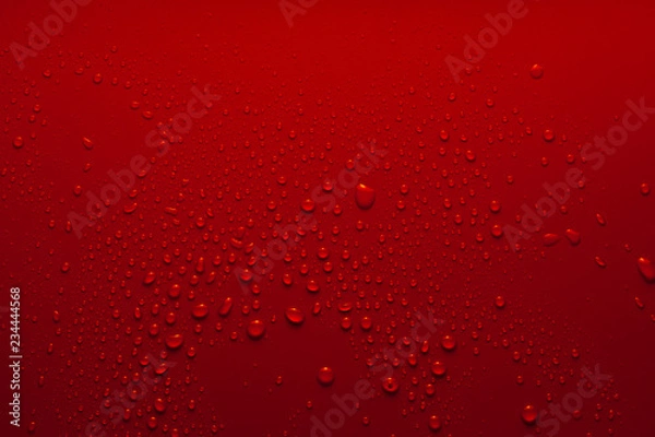 Obraz Water drops on a red background