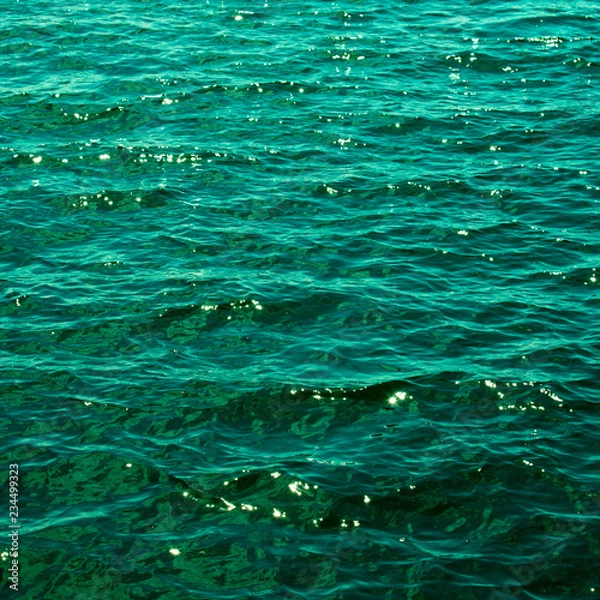 Obraz The emerald green water of the Baltic Sea glistens in the sun a few days after midsummer, near the Island of Nicklösa in the Åland Islands, Finland.