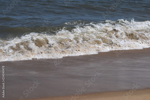 Fototapeta Rolling waves on the beach