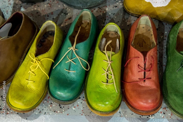 Fototapeta handmade shoes standing in a row