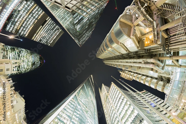 Obraz Looking directly up at London financial district skyline at night 