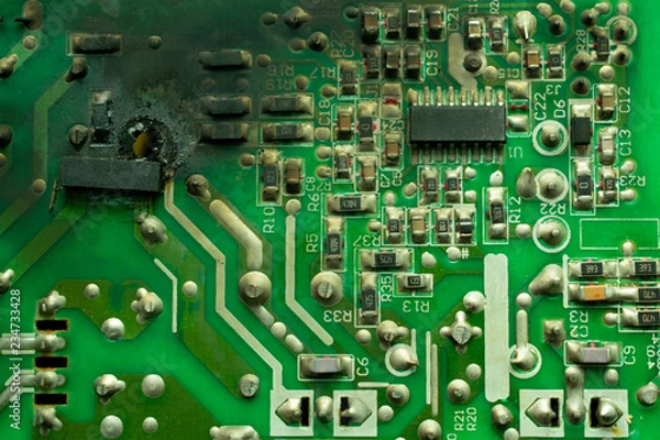 Fototapeta burnt electronics board, with black soot on the surface