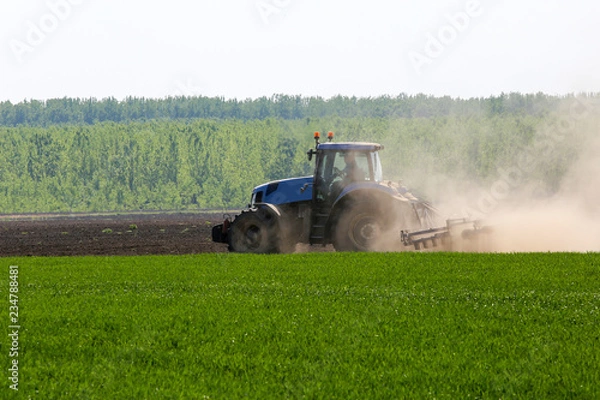 Obraz Heavy machine tractor plow work field