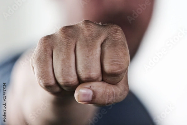 Obraz Aggressive man punching with fist