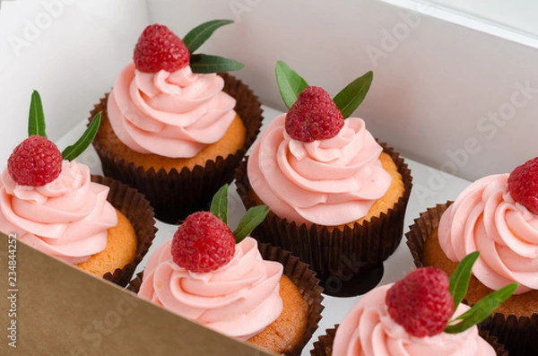 Fototapeta Cupcakes with raspberry cream.