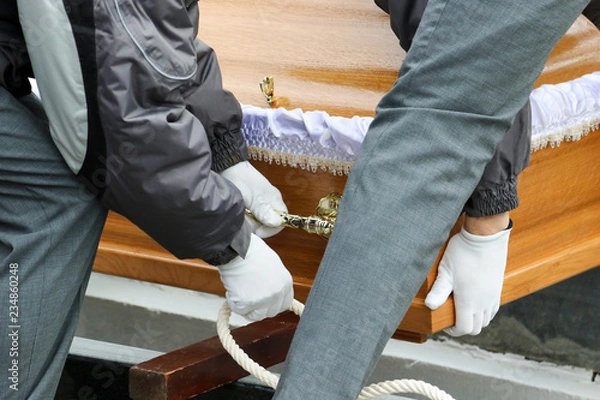 Obraz Putting a coffin in the ground