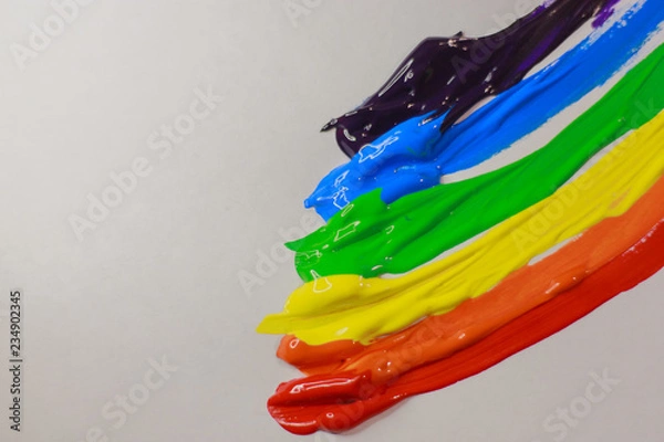 Fototapeta multi-colored paint on a white background smeared in a line