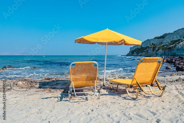 Obraz Two Yellow Lounge Chairs On The Beach By The Sea