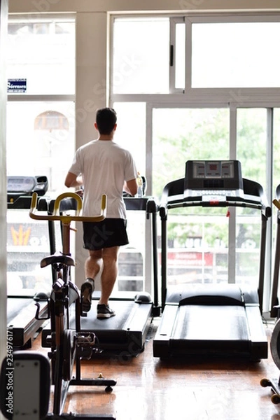 Obraz men running at gym 