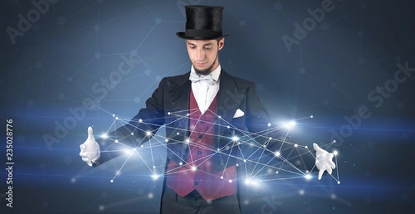 Fototapeta Magician with blue background and geometrical connection between two hands
