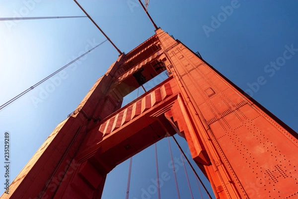Obraz Looking up at Golden Gate Bridge support tower