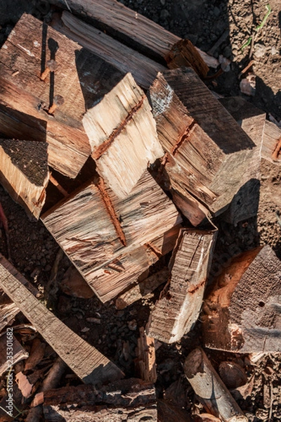 Fototapeta Stack of firewood, background stacks of wood. Dry chopped firewood, ready for winter.
