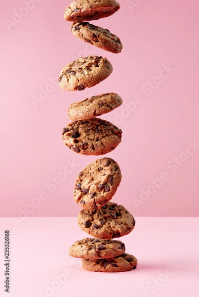 Obraz Chocolate chip cookies falling in stack