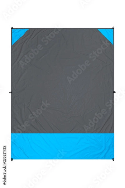 Fototapeta Gray and blue nylon beach blanket isolated on white background with visible corner pockets. Very thin and waterproof tarp or footprint for outdoor activities. Clipping path included.