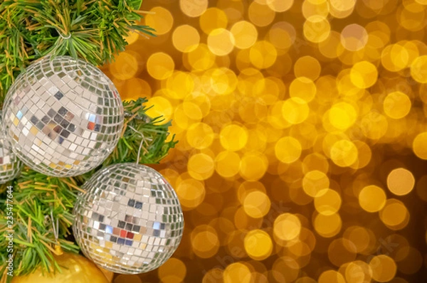 Fototapeta Glass ball ornaments on a Christmas tree and blurred lights. with clipping path.