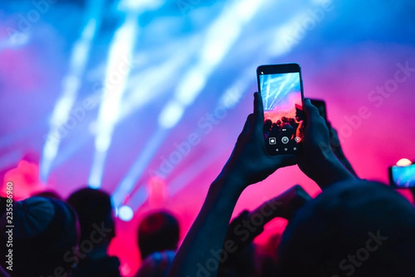 Fototapeta spectators at a concert phone close-up live broadcast