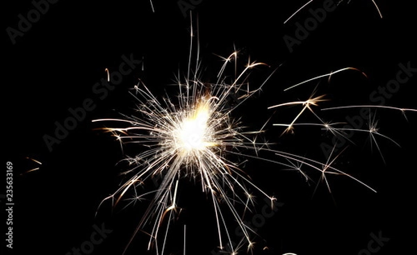 Obraz Ignited sparkler isolated on black background with clipping path