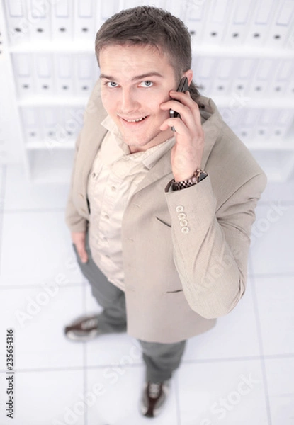 Fototapeta view from the top.successful young businessman looking at the c