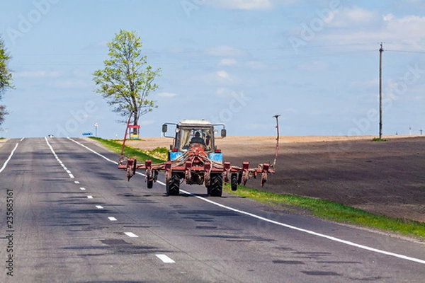 Obraz Tractor on the country road