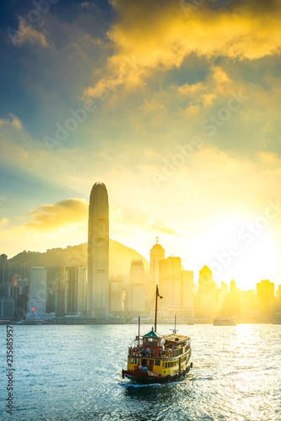 Obraz The Boat on Victoria harbour with sunset at Hong Kong.