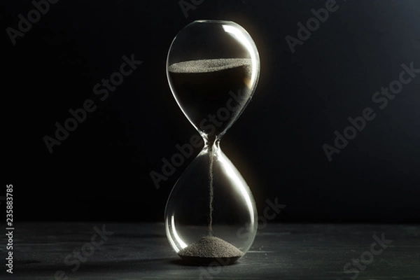 Obraz Hourglass on dark background