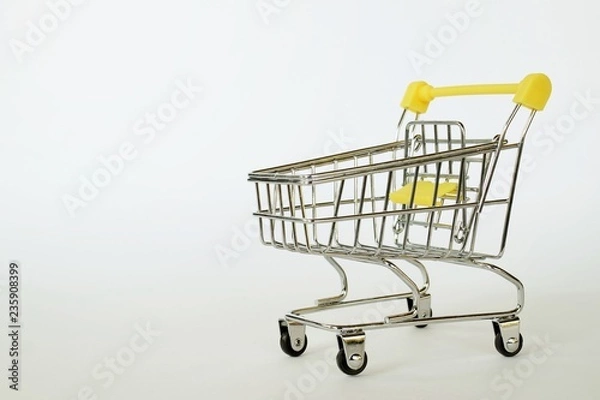 Obraz Supermarket cart on white background.