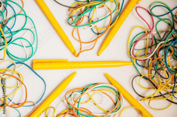 Fototapeta Colored stationery with stationery elastic bands