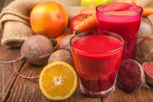Obraz Smoothie from beetroot, lemon, grapefruit, carrots and apples. Fresh, healthy and homemade.