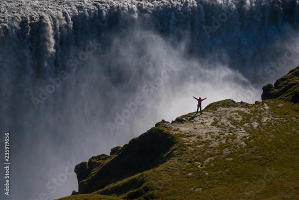 Obraz Happy tourist against Dettifoss waterfall background