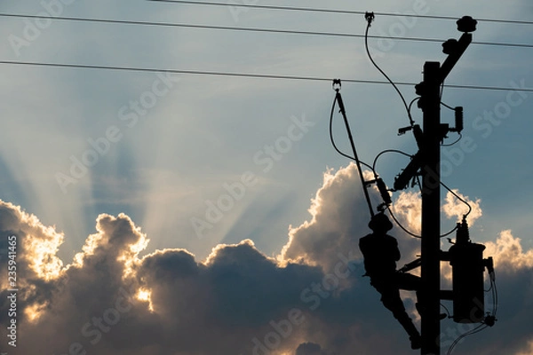 Fototapeta Silhouette, power lineman use clamp stick (insulated tool) to closing a transformer on energized high-voltage electric power lines. Isolated from background with clipping path.