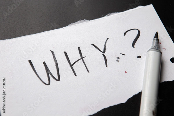 Fototapeta handwritten text Why as Question. written on white paper with black marker. Concept meaning Asking for specific answers of something interrogate