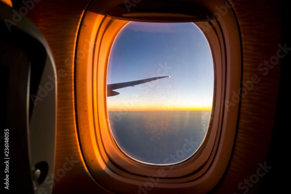 Obraz Airplane window during the flight sunset