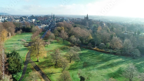 Obraz Low level aerial image of Pittencrieff Park in Dunfermline on an early winter’s day with hazy sunlight.