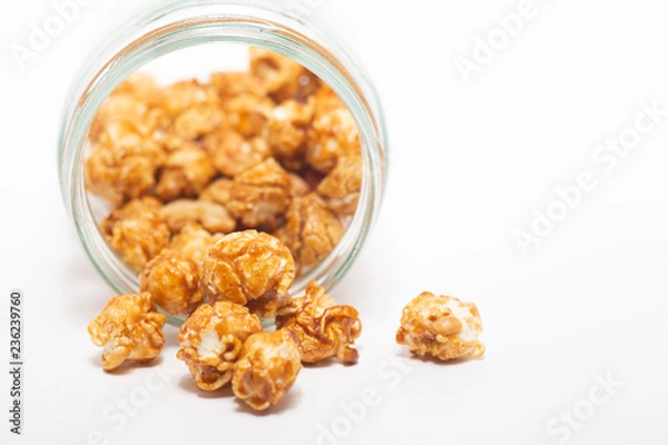 Fototapeta Caramel popcorn on white background.