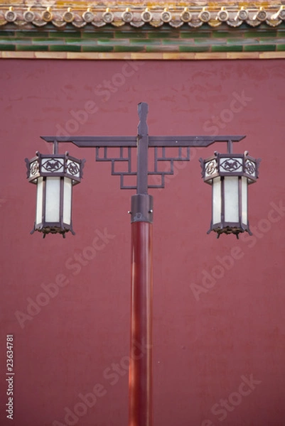 Fototapeta Ancient lantern against red wall
