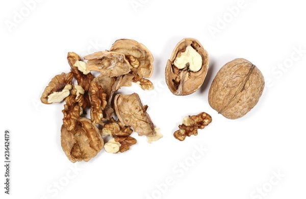 Fototapeta Cracked walnuts, isolated on white background, top view