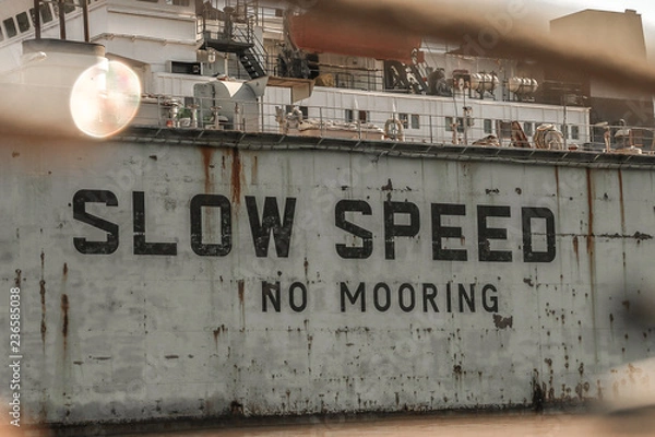 Fototapeta warning slow speed in sea port	