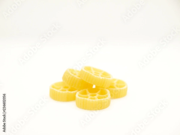 Obraz Raw round pasta on white background