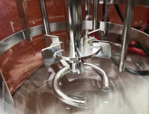 Fototapeta Interior of a laboratory equipment to make mixtures. Small scale reactor with detail of its agitation mechanism.