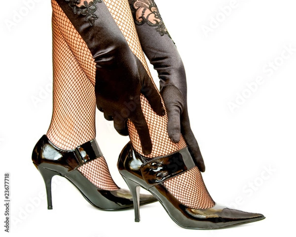 Obraz Woman hands in gloves touching leg isolated on white