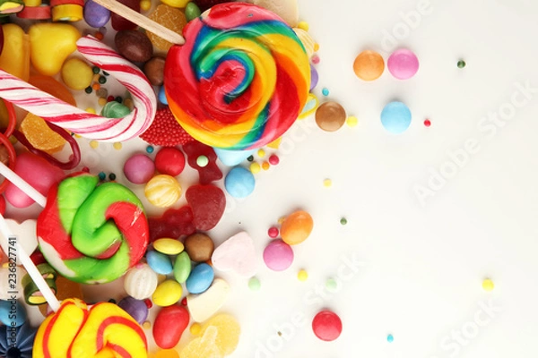 Fototapeta candies with jelly and sugar. colorful array of different childs sweets and treats.
