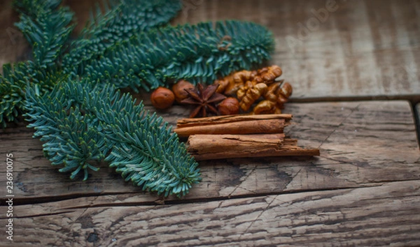 Fototapeta green fir branches on the background of boards
