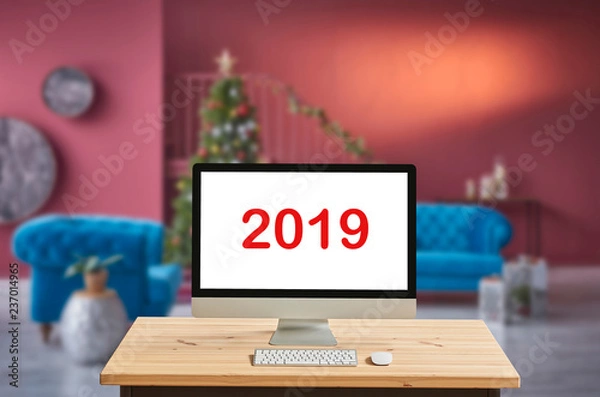 Fototapeta Desktop screen with Christmas concept, blur background, interior.