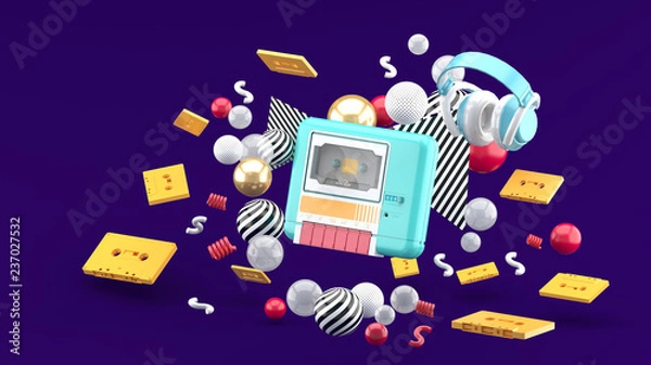 Fototapeta A blue tape player surrounded by tapes and colorful balls on a purple background.-3d rendering.