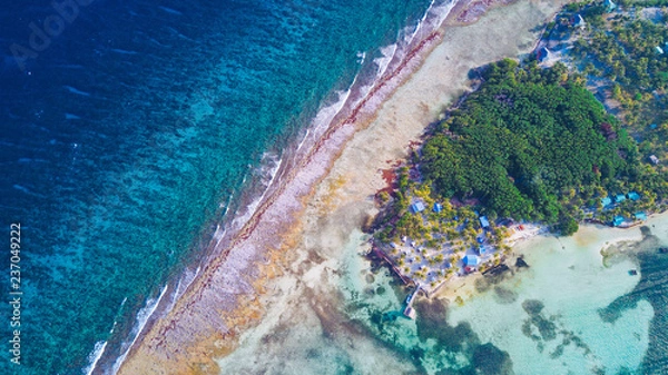 Fototapeta Aerial view of tropical island at Glover's Reef Atoll in Belize Barrier Reef